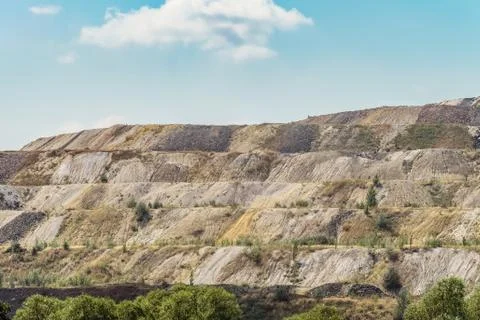 Dumps of processed iron ore. Waste from the iron ore industry. Stock Photos