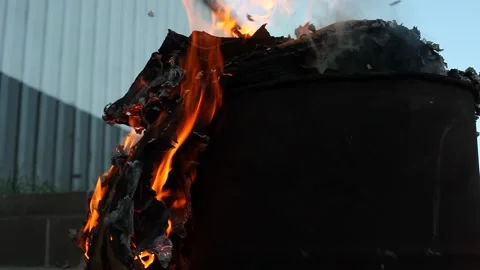 Dumpster Fire Large Orange Flames Lick Out of Trashcan Fire Stock Footage 206764946