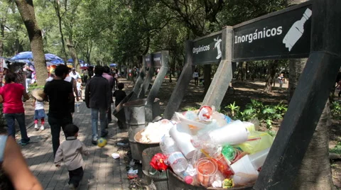 Dumpsters full garbage, people pass and drop their garbage. TIME LAPSE-FULL SHOT Stock Footage 41073026