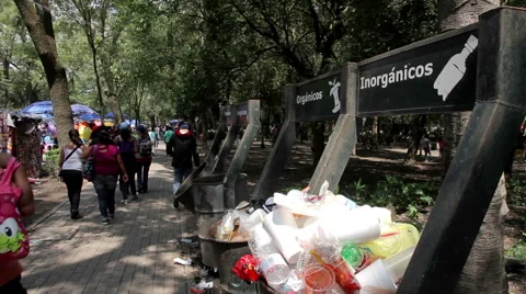 Dumpsters full garbage, people pass and drop their garbage. Stock Footage 52540804