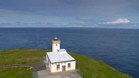 Duncansby Head lighthouse flying over the sea 스톡 동영상 336794811