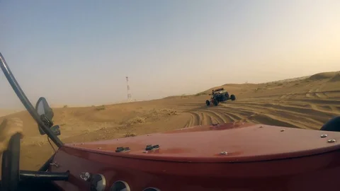 Dune Buggy Desert Trail Sand riding surfing hot dubai go kart Stock Footage 129565019