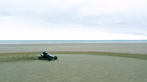 Dune Buggy Donuts on Beach Aerial Drone Footage Stock Footage 196983972