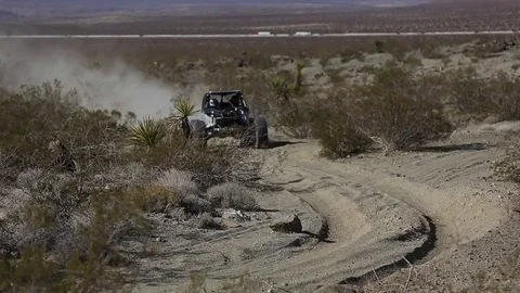 Dune buggy kicking up dust Video stock 77608156