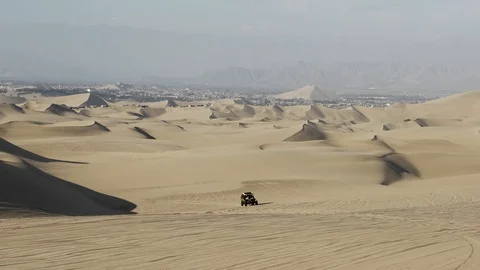 Dune buggy running on the immense sand dune of Huacachina, Ica, Peru. Stock Footage 125272576