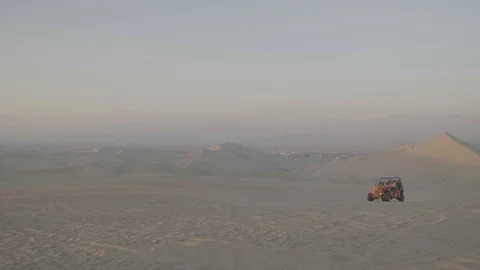 Dune buggy running on the immense sand dune of Huacachina, Ica, Peru. Stock Footage 125273416