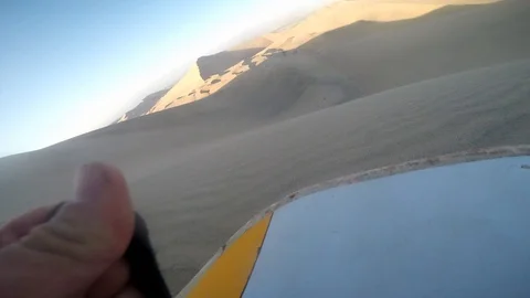 Dune buggy running on the immense sand dune of Huacachina, Ica, Peru. Stock Footage 125273925