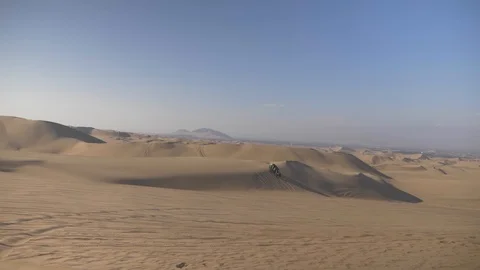 Dune buggy running on the immense sand dune of Huacachina, Ica, Peru. Stock Footage 125274069