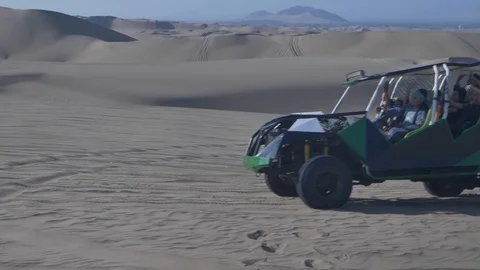Dune buggy running on the immense sand dune of Huacachina, Ica, Peru. Stock Footage 125274095