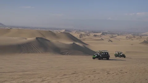 Dune buggy running on the immense sand dune of Huacachina, Ica, Peru. Stock Footage 125274114