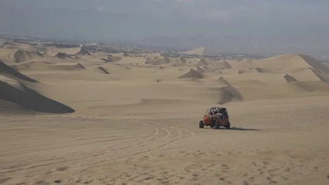 Dune buggy running on the immense sand dune of Huacachina, Ica, Peru. Stock Footage 125274123