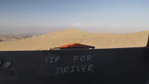 Dune buggy running on the immense sand dune of Huacachina, Ica, Peru. Stock Footage 125274272