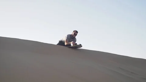 Dune buggy running on the immense sand dune of Huacachina, Ica, Peru. Stock Footage 125274480