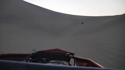 Dune buggy running on the immense sand dune of Huacachina, Ica, Peru. Видео 125274517