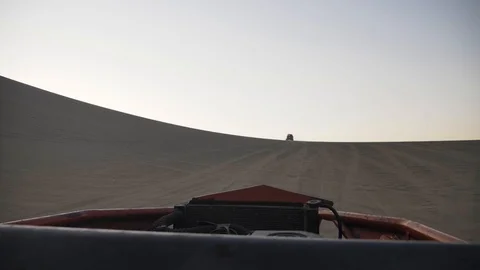 Dune buggy running on the immense sand dune of Huacachina, Ica, Peru. Видео 125274530