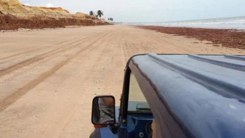Dune-buggy runs on a beach Stock Footage 132618210