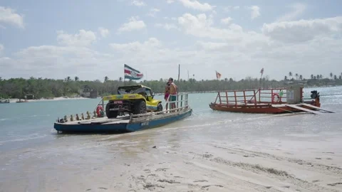 Dune Buggy Transported by Small Ferry Across Sandy Riverbank in Jericoacoara Stockbeeldmateriaal 335266088
