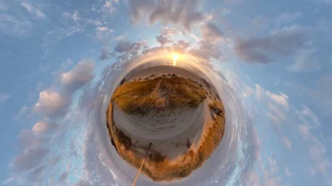 A dune covered in dune grass by the sea at sunset, Video-Effect Stockbeeldmateriaal 334737206