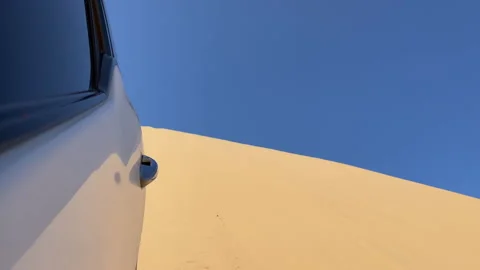 Dune driving in desert. White SUV car off road travel in Africa. Video stock 168904680