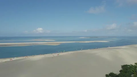 Dune of Pilat with paragliders taking flight at the top panoramic view of Stock Footage 164022257