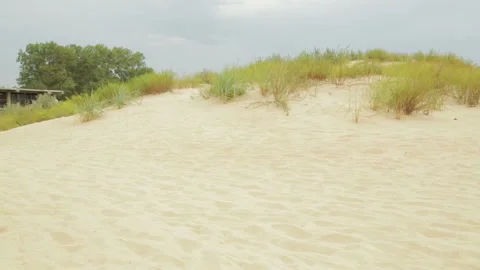 Dune sandy beach overlooking the blue sea. Видео 122687103