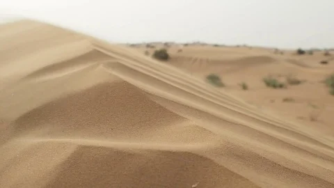 Dune in the wind. wavy texture of the sand. Erosion and desertification Stock Footage