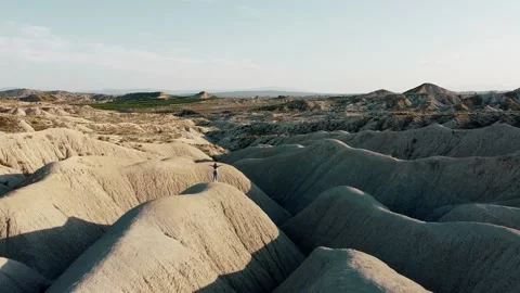 Dunes desert landscape drone point of view of woman on vacations at sunset Stock Footage 158542087