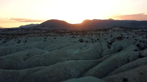 Dunes desert landscape drone point of view of woman on vacations at sunset Stock-Footage 158542351