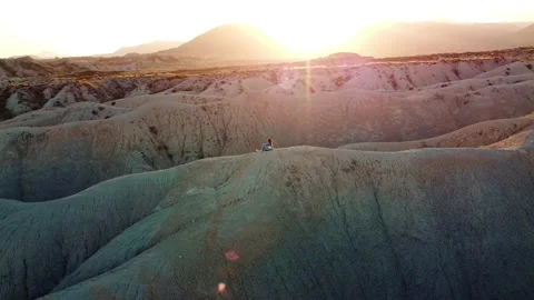 Dunes desert landscape drone point of view of woman on vacations at sunset Video stock 158542432