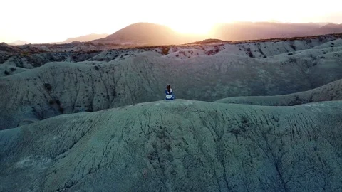 Dunes desert landscape drone point of view of woman on vacations at sunset Stock Footage 158542453