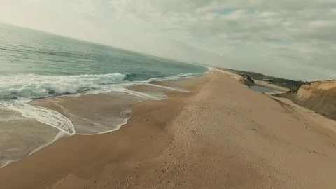 Dunes meet waves with gentle, rolling motion Stock Footage 340227018