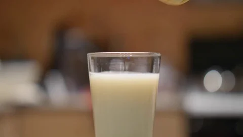 Dunking a Biscuit in Milk Stock Footage 74591836