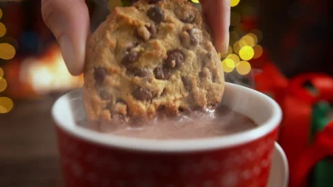 Dunking a Chocolate Chip Cookie in Cup of Hot Cocoa in Slow Motion on Christmas Stock Footage 208931929