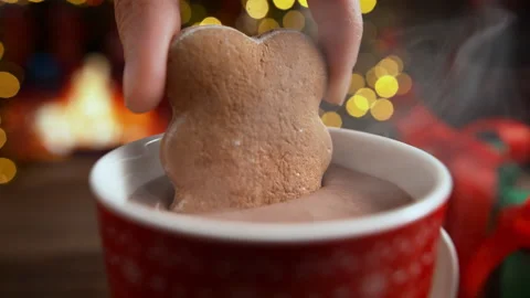 Dunking Gingerbread Biscuit in Cup of Hot Chocolate in Slow Motion on Christmas Stock Footage 208931995