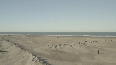 Dunkirk beach, ocean, lighthouse and factories (Dunkerque, France) d-log Stock Footage 102437193