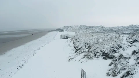 Dunkirk beach in snow, blockhaus, sand dunes and people (Dunkerque, France) Stock Footage 101747644