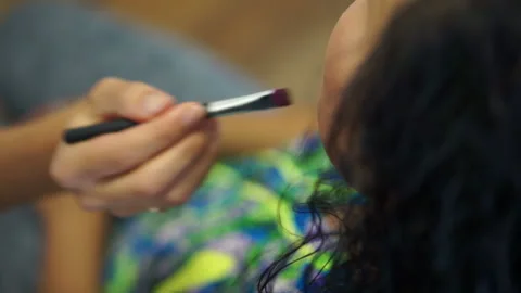 Dunks the brush into the cream Stock Footage 98482315