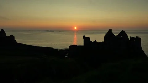 Dunluce Castle during sunset, Northern Ireland Stock Footage 64208570