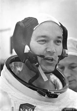 Dunned in his space suit, Command Module (CM) pilot Michael Collins does a... Stock Photos