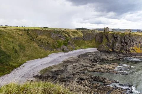 Dunnottar Castle rises ruins atop a cliff, North Sea.Beautiful views, history Stock Photos