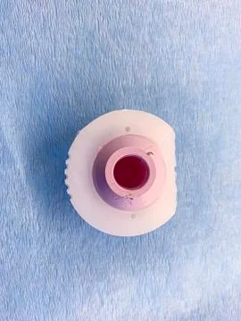 A duo head hip prosthesis is placed on a light blue cloth, with the cup made Stock Photos