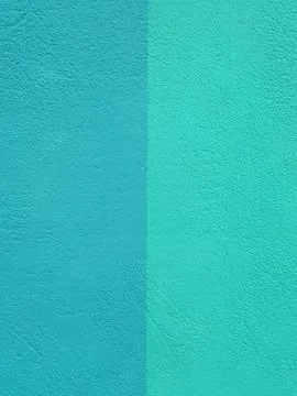 Duo tone textured wall background in varying shades of blue and teal Stock Photos