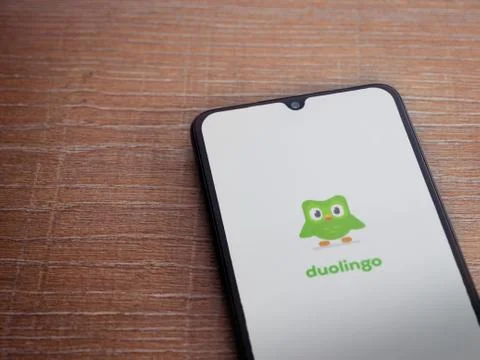 Duolingo - Language learning app launch screen with logo on the display of a  Stock Photos