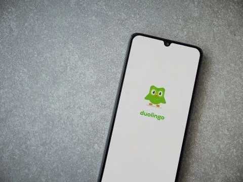 Duolingo - Language learning app launch screen with logo on the display of a  Stock Photos