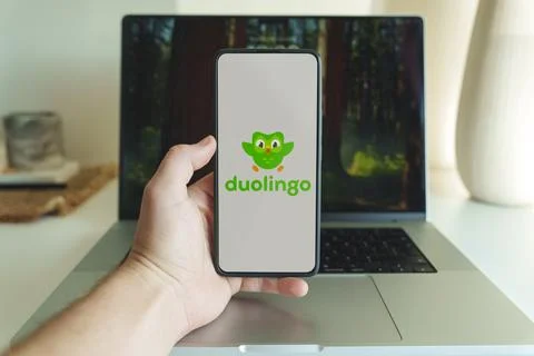 Duolingo language learning application logo in front of laptop Stock Photos