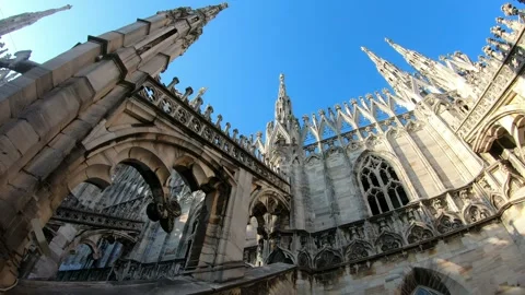 Duomo, A large white building with a steeple and a clock tower Stock Footage 313597614