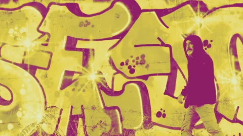 Duotone of man walking in front of graffiti - 4K - ProRes Stock Footage 162839900