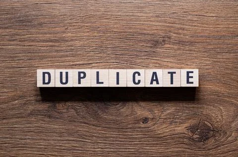 Duplicate - word concept on building blocks, text Stock Photos