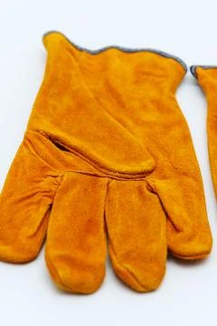 Durable split leather gloves for protection in tough work settings Stock Photos