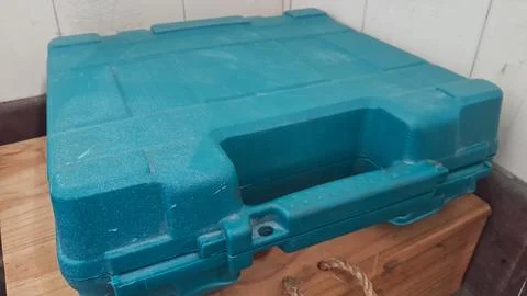 Durable teal plastic carrying case for storing heavy power tools Stock Photos